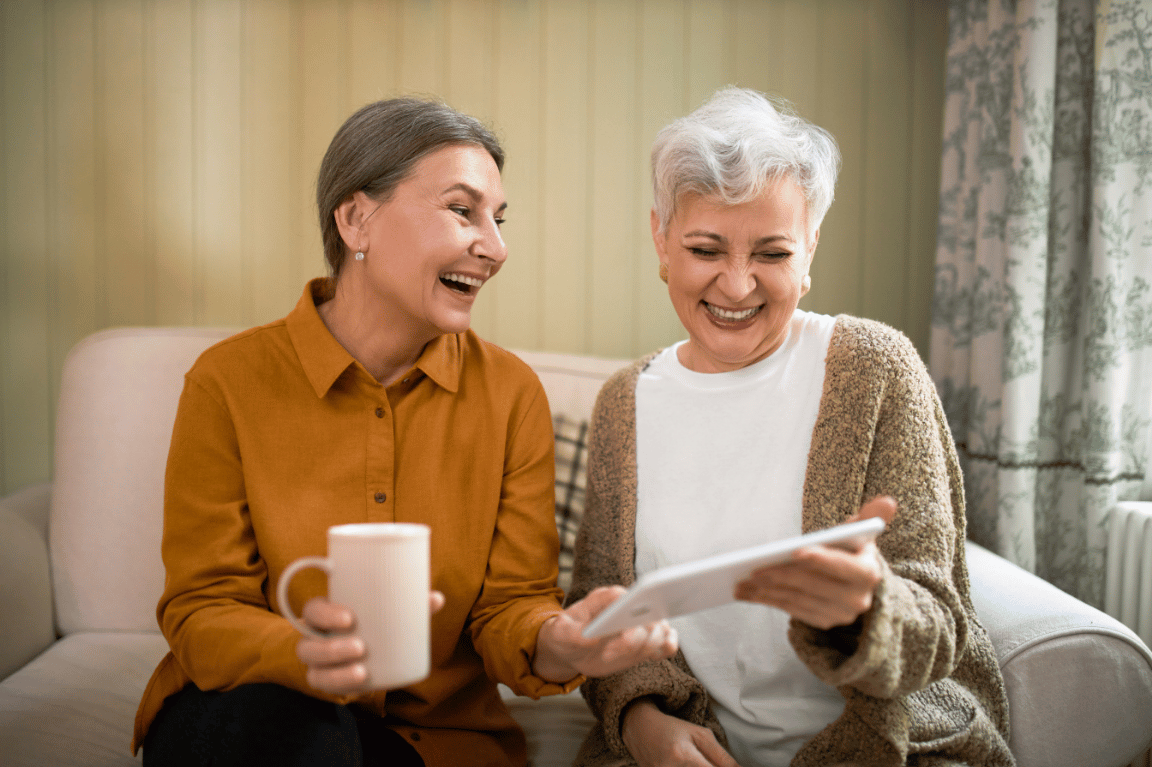 Two women looking at a tablet