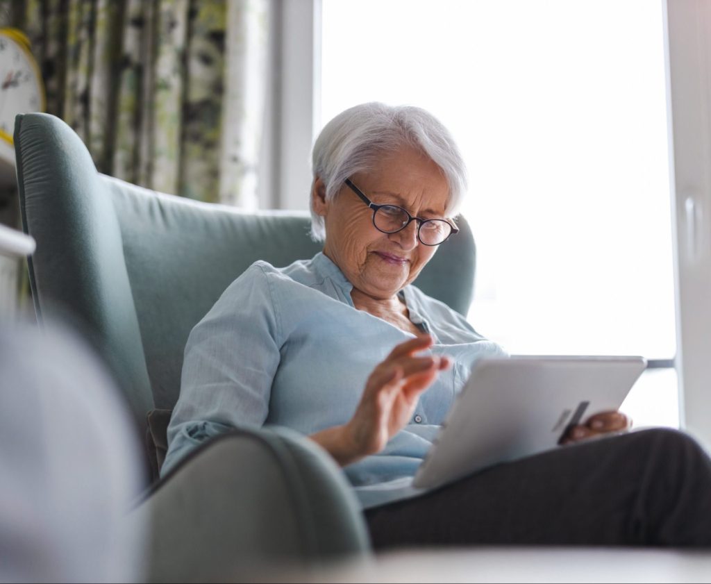 Elderly woman on her tablet