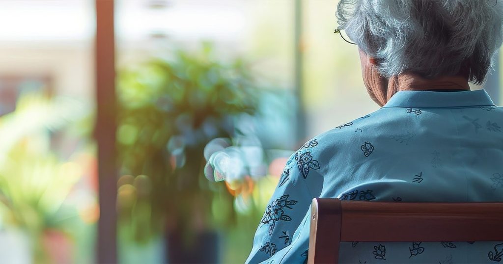 Elderly looking out the window